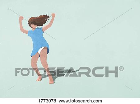 Carefree woman in dress dancing on blue background View Large Photo Image Stock Photo - Carefree woman in dress dancing on blue background. Fotosearch