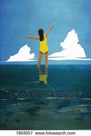 Carefree woman with arms outstretched wading in summer ocean View Large Photo Image Stock Photo - Carefree woman with arms outstretched wading in summer ocean. Fotosearch