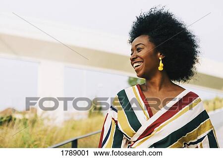 Carefree young woman laughing View Large Photo Image Stock Image - Carefree young woman laughing. Fotosearch