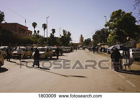 Cars and pedestrians on sunny road, Marrakesh, Morocco View Large Photo Image Stock Photo - Cars and pedestrians on sunny road, Marrakesh, Morocco. Fotosearch