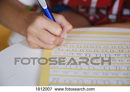 Child practicing cursive handwriting View Large Photo Image Stock Photo - Child practicing cursive handwriting. Fotosearch