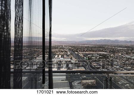 Stock Image - Cityscape seen through balcony against sky, Las Vegas, Nevada, USA. Fotosearch