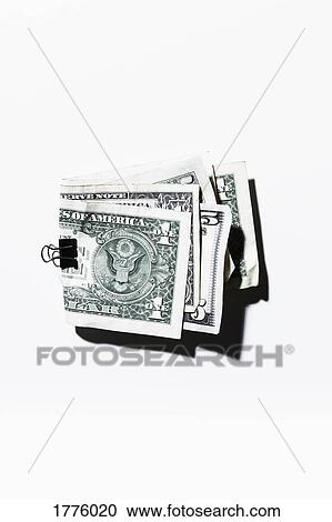 Clip holding folded one and five dollar bills View Large Photo Image Stock Image - Clip holding folded one and five dollar bills. Fotosearch
