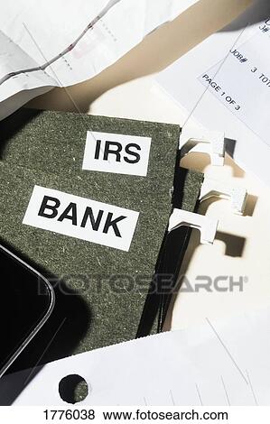 Close up bank and IRS tax files and finance paperwork View Large Photo Image Stock Photo - Close up bank and IRS tax files and finance paperwork. Fotosearch