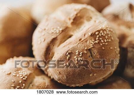 Close up fresh baked wheat roll with seeds View Large Photo Image Stock Photo - Close up fresh baked wheat roll with seeds. Fotosearch