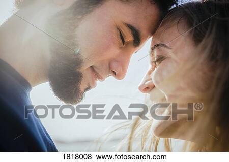 Stock Photo - Close up happy, affectionate couple. Fotosearch