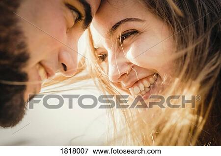 Close up happy couple head to head View Large Photo Image Stock Photo - Close up happy couple head to head. Fotosearch