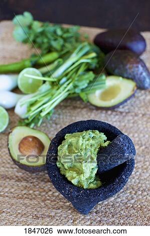 Close up homemade, fresh guacamole in mortar View Large Photo Image Stock Photograph - Close up homemade, fresh guacamole in mortar. Fotosearch