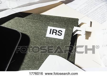 Close up IRS taxes file and finance paperwork View Large Photo Image Stock Photograph - Close up IRS taxes file and finance paperwork. Fotosearch