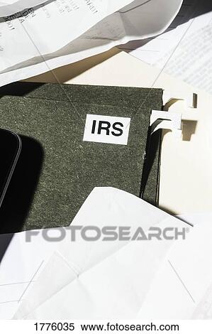 Close up IRS taxes file and finance paperwork View Large Photo Image Stock Photography - Close up IRS taxes file and finance paperwork. Fotosearch
