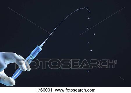 Close up liquid squirting from syringe View Large Photo Image Stock Image - Close up liquid squirting from syringe. Fotosearch