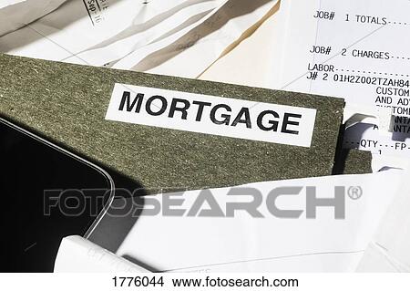Close up mortgage file and finance paperwork View Large Photo Image Picture - Close up mortgage file and finance paperwork. Fotosearch