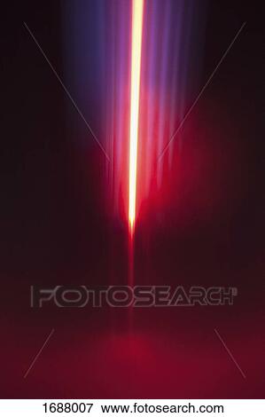 Stock Photo - Close-up of abstract red and blue light trails against black background. Fotosearch