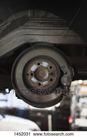 Close-up of car machine part in garage View Large Photo Image Stock Image - Close-up of car machine part in garage. Fotosearch