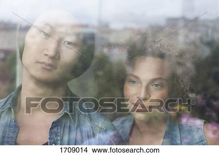 Close-up of couple seen through glass window View Large Photo Image Picture - Close-up of couple seen through glass window. Fotosearch