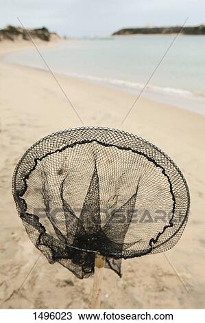 Close-up of fishing net at beach View Large Photo Image Stock Image - Close-up of fishing net at beach. Fotosearch