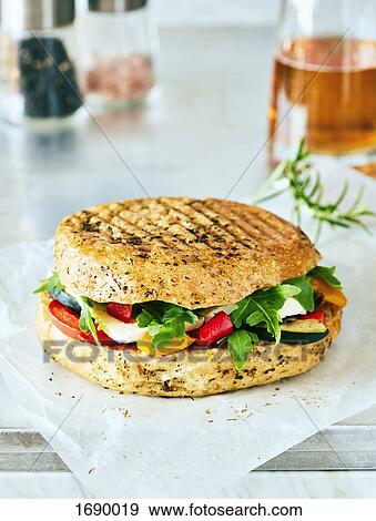 Stock Photo - Close-up of fresh burger on table. Fotosearch