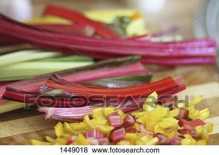 Stock Photo - Close-up of fresh chopped rhubarb on table. Fotosearch