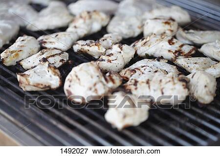 Close-up of grilled chicken meat on barbeque grill View Large Photo Image Stock Photo - Close-up of grilled chicken meat on barbeque grill. Fotosearch