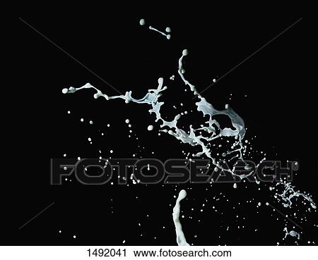 Close-up of milk splashing against black background View Large Photo Image Stock Image - Close-up of milk splashing against black background. Fotosearch