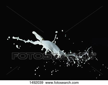Close-up of milk splashing against black background View Large Photo Image Stock Photo - Close-up of milk splashing against black background. Fotosearch