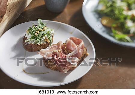 Close-up of open faced sandwiches in plate on table View Large Photo Image Stock Photo - Close-up of open faced sandwiches in plate on table. Fotosearch