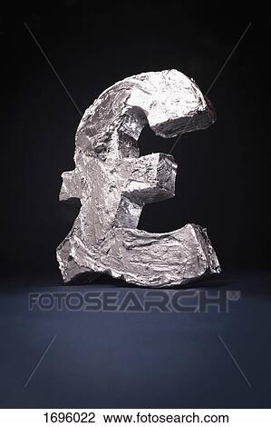 Stock Image - Close-up of pound symbol against black background. Fotosearch