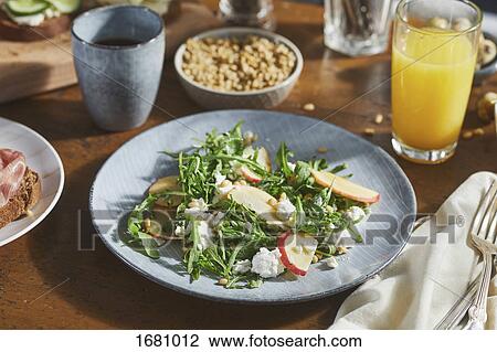 Close-up of salad in plate on table View Large Photo Image Stock Image - Close-up of salad in plate on table. Fotosearch