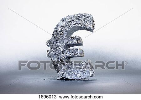 Stock Image - Close-up of silver Euro symbol against gray background. Fotosearch