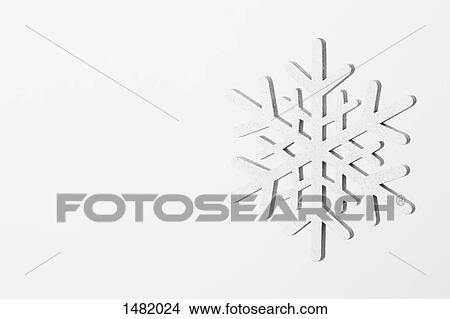 Close-up of snowflake on white background View Large Photo Image Picture - Close-up of snowflake on white background. Fotosearch