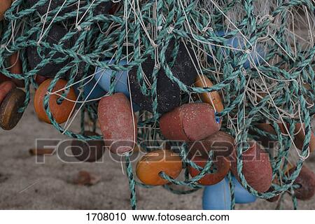 Close-up of tangled fishing net and buoys at beach, Tayrona, Columbia View Large Photo Image Stock Image - Close-up of tangled fishing net and buoys at beach, Tayrona, Columbia. Fotosearch