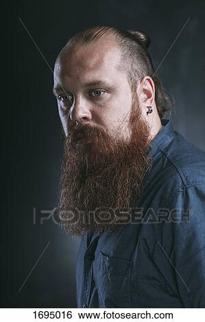 Close-up of thoughtful hipster against gray background View Large Photo Image Stock Photograph - Close-up of thoughtful hipster against gray background. Fotosearch