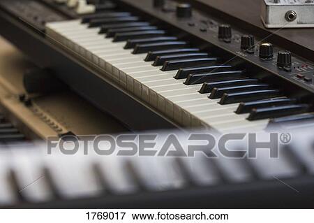 Close up piano keyboards and sound recording equipment View Large Photo Image Stock Photo - Close up piano keyboards and sound recording equipment. Fotosearch