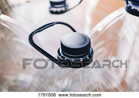 Close up plastic water bottles with handles View Large Photo Image Stock Photo - Close up plastic water bottles with handles. Fotosearch