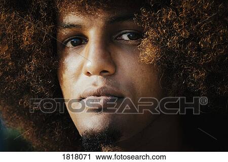 Close up portrait confident, serious young man with afro View Large Photo Image Stock Image - Close up portrait confident, serious young man with afro. Fotosearch