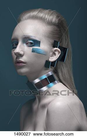 Close-up portrait of confident fashion model against blue background View Large Photo Image Stock Photo - Close-up portrait of confident fashion model against blue background. Fotosearch