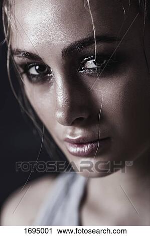 Stock Image - Close-up portrait of young woman. Fotosearch