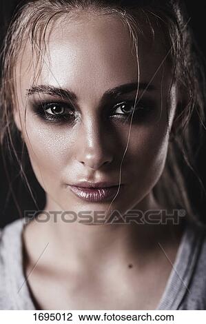Close-up portrait of young woman with messy hair View Large Photo Image Stock Image - Close-up portrait of young woman with messy hair. Fotosearch