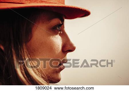 Picture - Close up profile serious woman looking away. Fotosearch