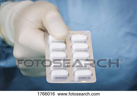 Close up scientist holding blister pack of pills View Large Photo Image Stock Photograph - Close up scientist holding blister pack of pills. Fotosearch