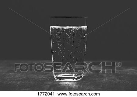 Close up sparkling water in glass View Large Photo Image Stock Image - Close up sparkling water in glass. Fotosearch