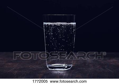 Stock Photography - Close up sparkling water in glass. Fotosearch