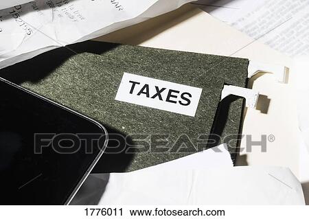 Close up taxes file and finance paperwork View Large Photo Image Stock Image - Close up taxes file and finance paperwork. Fotosearch