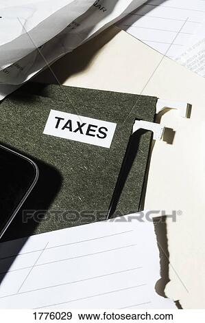 Close up taxes file and finance paperwork View Large Photo Image Stock Photo - Close up taxes file and finance paperwork. Fotosearch