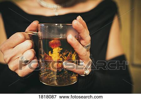 Close up woman drinking blooming tea View Large Photo Image Stock Photo - Close up woman drinking blooming tea. Fotosearch