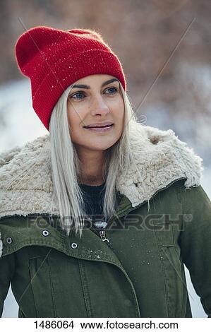 Close-up young woman looking away during winter View Large Photo Image Picture - Close-up young woman looking away during winter. Fotosearch