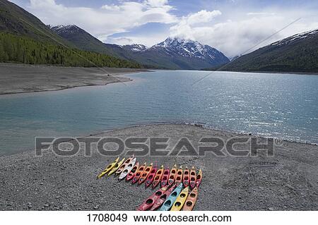 Colorful canoes at beach against sky, Anchorage, Alaska View Large Photo Image Stock Photo - Colorful canoes at beach against sky, Anchorage, Alaska. Fotosearch