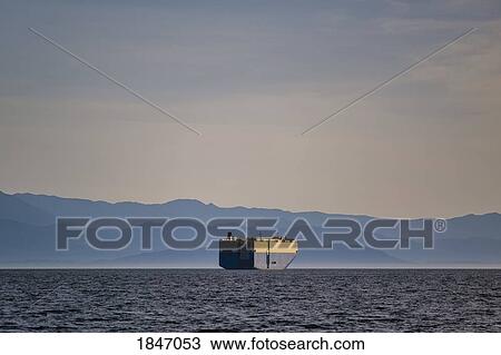 Container ship on sunny, idyllic ocean with Olympic Mountain Range in background View Large Photo Image Stock Image - Container ship on sunny, idyllic ocean with Olympic Mountain Range in background. Fotosearch