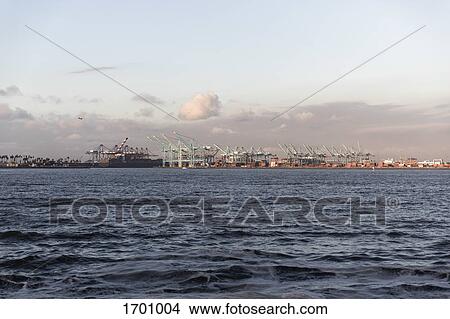 Cranes at commercial dock seen from sea against sky, Los Angeles Harbor, California, USA View Large Photo Image Picture - Cranes at commercial dock seen from sea against sky, Los Angeles Harbor, California, USA. Fotosearch