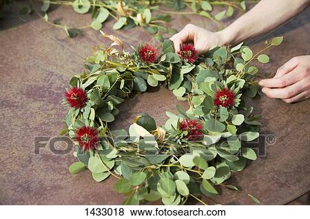 Cropped hand making wreath outdoors View Large Photo Image Stock Photo - Cropped hand making wreath outdoors. Fotosearch